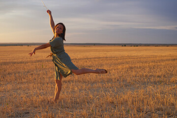 Girl jumping at sunset