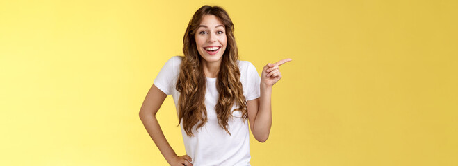 Lively surprised happy enthusiastic good-looking woman long curly hairstyle white t-shirt laughing...