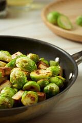 Roasted brussel sprouts in a black frying pan