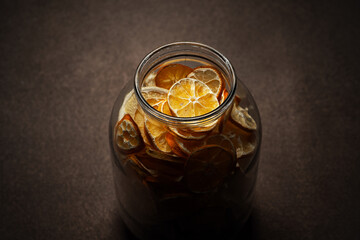 Glass jar with dried oranges. Decorative elements