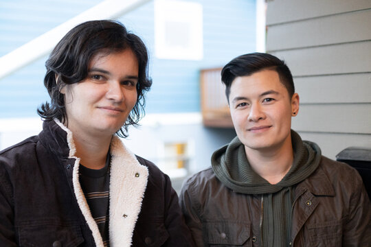 Trans friends smiling and enjoying the holidays.