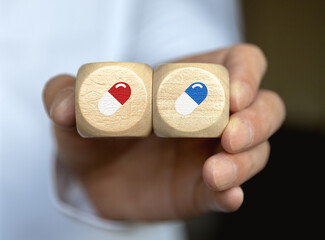 Red and blue pills on cube