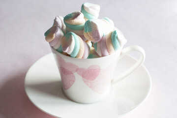 light pink and white marshmallows in a beautiful ceramic cups with pink hearts