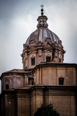 Old church facade with dome and cross on top