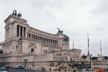 Facade of old building with monument