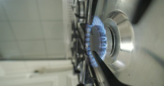 Gas cooker turn on, vertical 4K slow motion