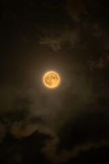 Beautiful magic fullmoon night sky with clouds and fullmoon and stars