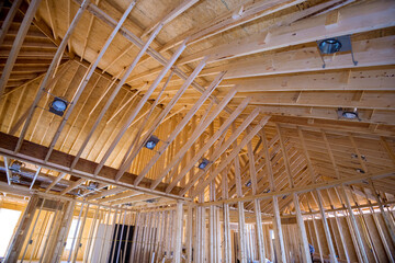 Lighting lamp mounted ceiling Lighting of newly constructed home. Installed light lamp into ceiling wood beam framework