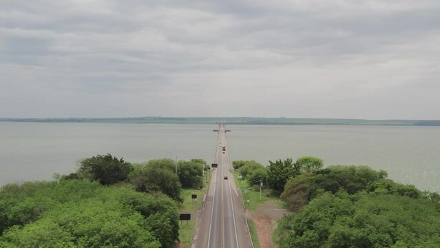 Aerial capture of the Tiet&ecirc; River. Intermodal waterway port. 4K, front view flying over the road.