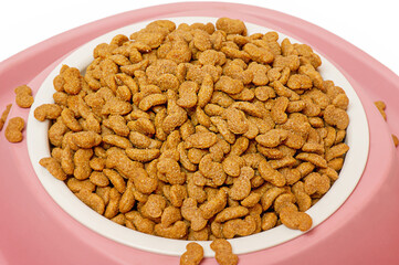 Holistic class dog food in a pink and white bowl. Useful food for animals. Balanced nutrition.