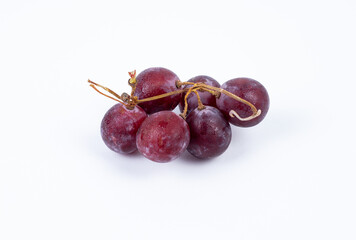 Red fresh grapes isolated on white background
