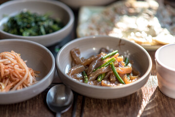 Assortment of Korean food in a Korean traditional restaurant. 