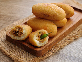 Combro indonesian traditional food in wooden tray. combro made of processed cassava root.