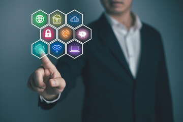 Blue fingerprint scan icon on virtual screen while finger scanning for security access with biometrics identification on dark. Cyber security, privacy data protection technology for business..