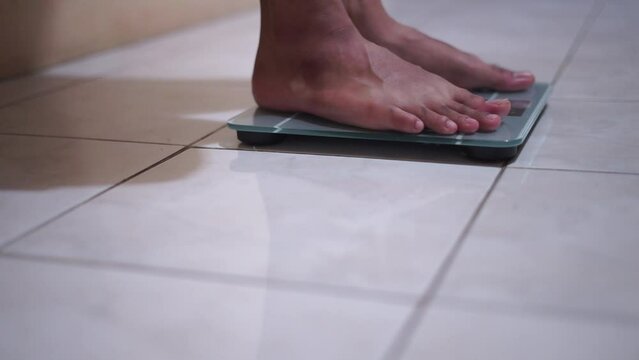 Man Feet Standing Weighing Scales, Checking BMI Weight Loss. Barefoot Measuring Body Fat Overweight