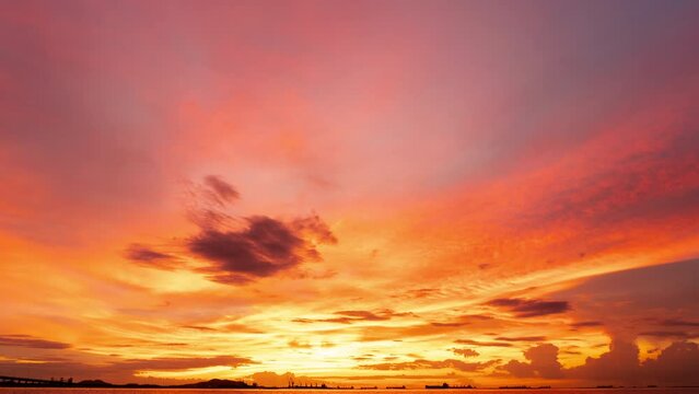Sunset timelapse 4k Colorful sunset at the sea. Romantic Sunet go down, blue and orange clouds flow in sky. Majestic summer landscape. Beautiful sky fluffy clouds evening day