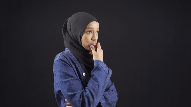 Stressed and worried African Muslim young woman in hijab.
Worried and panicked African muslim teenage girl in hijab.
