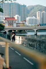 Sunset Hong Kong people chill in afternoon with tree and river