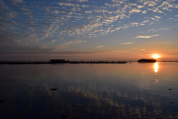 Naklejka premium sunset over the river