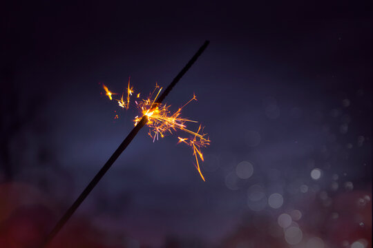 Wunderkerze - Neujahr / Silvester / Feier - Glittering - Burning sparkler, Happy New Year ,- blurred bokeh light