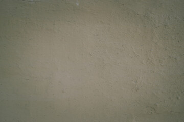 Gray structural painted wallpaper on the wall. Grunge texture background. Grungy painted wall with decorative parget gray stucco texture background. Structural plaster