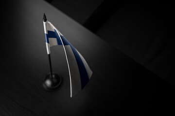 Small national flag of the Finland on a black background