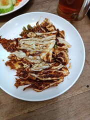 Fried cabbage leaves served as a snack