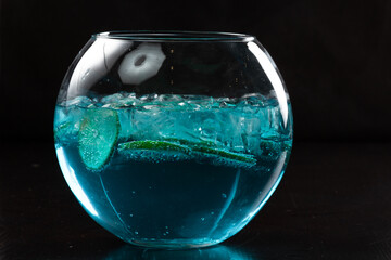 Blue lagoon cocktail with blue curacao liqueur, vodka, lemon juice and soda