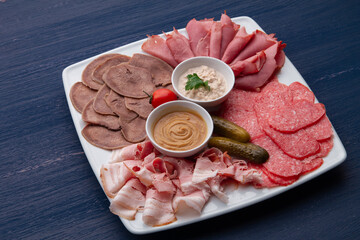 meat dish, sliced sausage, bacon and meat