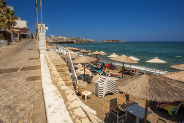 View of the beach and sunbathing on the Greek island of Crete in Hersonissos - 557533937