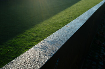Morning dew on a rusty metal surface