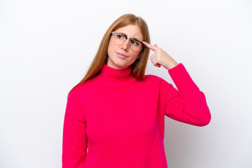 Young redhead woman isolated on white background making the gesture of madness putting finger on the head