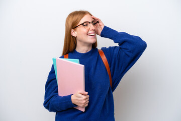 Young student redhead woman isolated on white background smiling a lot