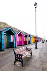 Colourful Wooden Beach Huts At Saltburn-by-the-Sea On The North Yorkshire Coast On A Misty Day