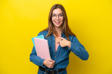 Obraz premium Young student caucasian woman isolated on yellow background with surprise facial expression