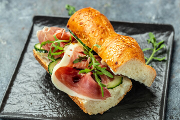 italian sandwiches with prosciutto, arugula, cucumber, Cured ham, spanish appetizer