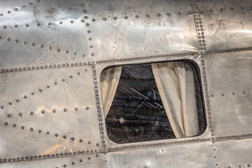passenger window with curtains, from an old airplane