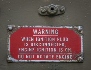 warning text at an old military airplane