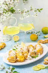 Limoncello. Traditional italian homemade alcoholic drink in glass with pieces of lemon, sweet Italian lemon liqueur. vertical image. top view. place for text