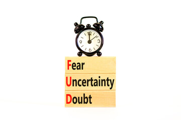 FUD fear uncertainty doubt symbol. Concept words FUD fear uncertainty doubt on wooden blocks on a beautiful white table white background. Business and FUD fear uncertainty doubt concept. Copy space.