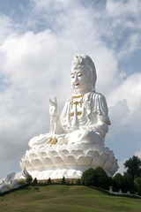 Guan yin statue on the peak hill at the temple in Thailand Statue of Guan Yin is the Goddess of Mercy and Compassion in the Buddhist religion. symbol of Mahayana Buddhism in Asian and East Asia.