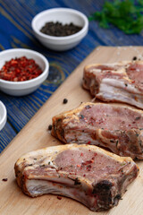 Raw pork meat . Chops on wooden background