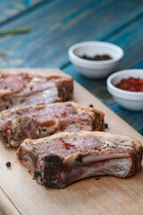 Raw pork meat . Chops on wooden background
