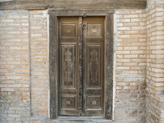Beautiful, vintage door with a metal handle. Close-up, outdoors. Day light. Vacation and travel concept