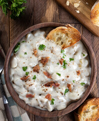 New England clam chowder with bacon, parsley and toasted bread