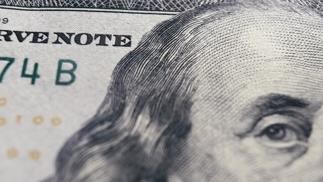 Macro texture banknotes shot close up 100 american dollar bills. Cash money banknotes. Franklin face texture, USD cash macro view.