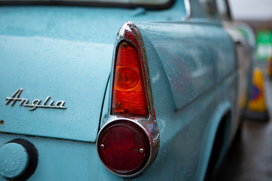 close up of rear  of Vintage blue and white Ford Anglia car