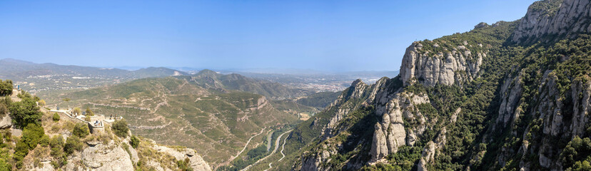 Fototapeta na wymiar A panoramic view of the mountains and El Llobregat River valley from Abbey of Montserrat