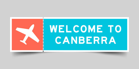 Orange and blue color ticket with plane icon and word welcome to canberra on gray background