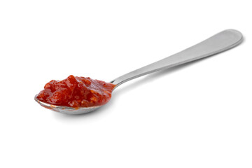 Metal spoon with red sambal, Indonesian chili sauce, isolated on white background